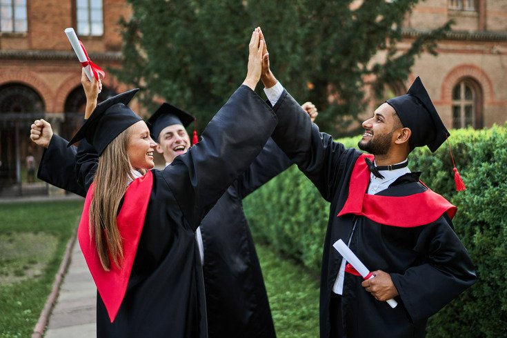 students celebrating their graduation