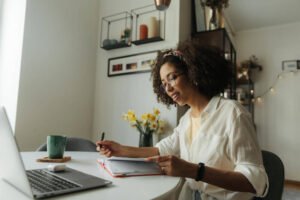 a woman typing on a laptop
