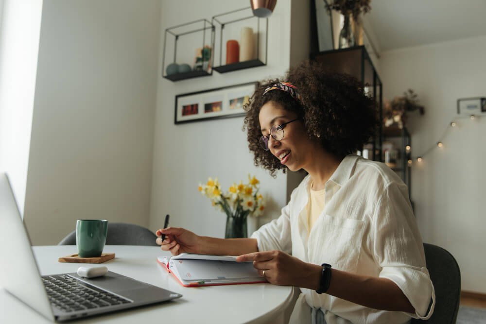 a woman typing on a laptop