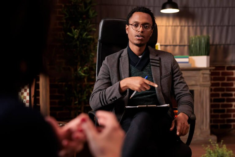 A guy counselling a client.