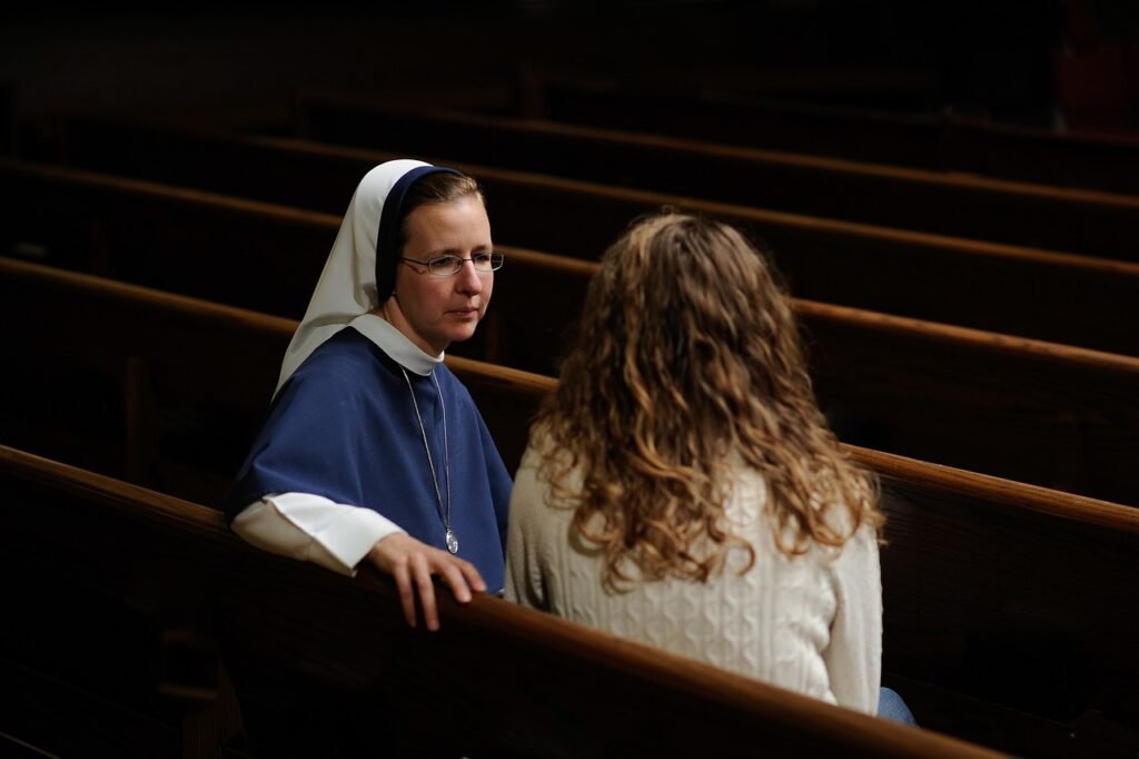 nun speaking to a woman